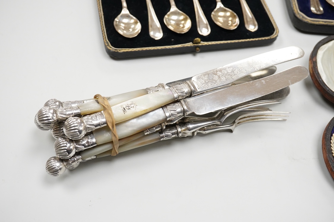 A cased Edwardian silver christening pair by Goldsmiths and Silversmiths Co Ltd, London, 1905, two cased sets of six silver teaspoons, one with a pair of sugar tongs, one other cased silver christening pair, a cased set